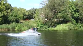 Wakeboard big jumps on a small lake by a pro
