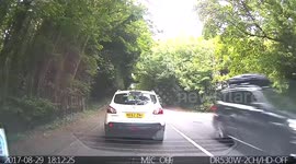 Crazy biker standing up with his arm behind his back