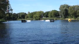 What happens when a beginner and a pro wakeboard together in a small lake