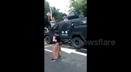 Armed police have water fight with children