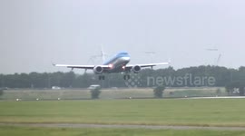 Plane landing in wind and go around