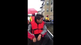 Respondents arrive to evacuate apartment residents in Katy, TX.