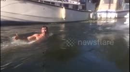 Man getting tied down a river with a boat