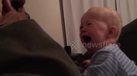 Baby is terrified by Chewbacca mask