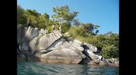 Malawi. Nkhata Bay. Malawi lake (17) Guy back jumping from cliff. 2016