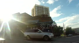 Man wearing cardboard box taking a walk with his helper