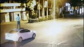 Drunk driver climbs onto roof of his moving car for 600-metres