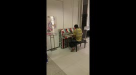 Construction worker plays piano in Hong Kong mall