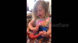 Two year old girl sings about her super hero