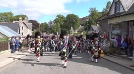 Massed highland pipe bands parade to the 2017 Braemar Gathering 2017