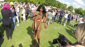 Sinitta arrives at Pup Aid even in dress made of dog biscuit