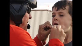 Dad pulls son's baby tooth with a helicopter