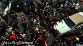 Mustang gets mugged by angry mob after crashing into crowd of people