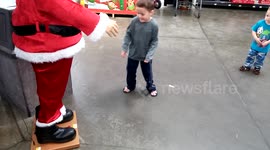 Boy scared of electronic Santa