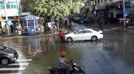 Miraculous escape for scooter driver flipped 360 degrees