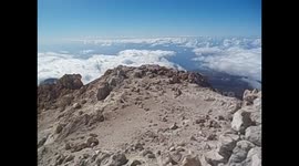 España. Spain. Tenerife. Parque Nacional El Teide. Summit 3.718m. Vistas 360º with smoke, active volcano with wind. 2016