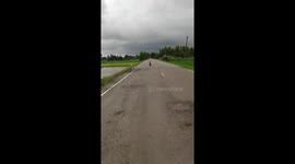 Daredevil Motorbike Rider Skidding Along Road In His Flip Flops