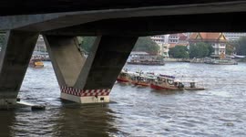 Tug boats pulling barges in Bangkok