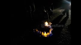 North Korea. DPRK. Nampo. Cooking clams with petrol alcohol. 2015