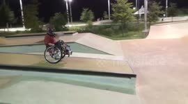 Woman with cerebral palsy masters wheelie to drop offf