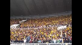 North Korea. DPRK. Pyongyang. Marathon 3. People public cheering up before starting, full stadium. 2015