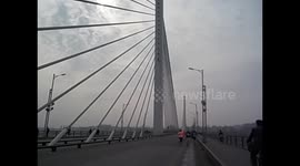 North Korea. DPRK. Pyongyang. Marathon 8. Crossing bridge. 2015 Race running competition