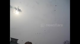 North Korea. DPRK. Pyongyang. Marathon 12. Parachutes landing inside stadium. 2015