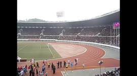North Korea. DPRK. Pyongyang. Marathon 13. Parachutes landing inside stadium. 2015