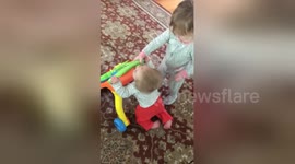 Newsflare Edit - Big sister helps her little sister walking
