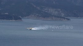 super scooper slow motion distant scooping and lift off