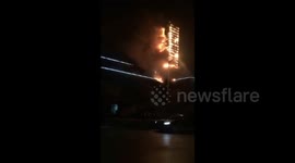 Dramatic video shows billboard burst into flames in China