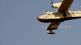 Super scooper slow motion very close-up flyover power lines