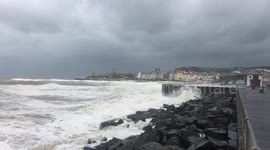 Stormy seas batter the seawall in Aberystwyth, slo motion video