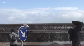 TV reporter runs to help elderly man hit by huge wave in San Sebastian