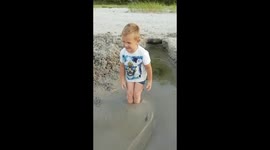 Boy stuck at sea sand