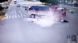 Scooter driver narrowly escapes death after running a red light