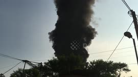 Huge cloud of black smoke rises from plastic recycling plant fire