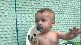 Baby cant get cake in mouth