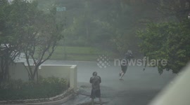 Man tries to stand up in Hurricane Irma winds