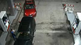 Car leaving petrol station with pump still attached stumbles staff