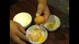 Cracking value! Man breaks egg to find another inside