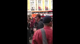 Hundreds of football fans chanting and marching through Oxford Street, London