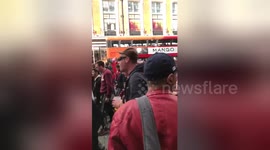 Newsflare Edit - Hundreds of football fans chanting and marching through Oxford Street, London
