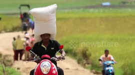 Riding a motorcycle with a 50 kg payload toned on the head