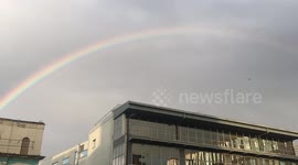 Rainbow above town after rainfall in London