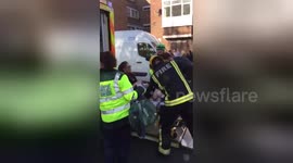 Injured woman on stretcher at Parsons Green