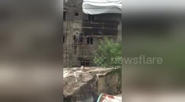 Kids dancing on bamboo scaffolding in Chennai, India