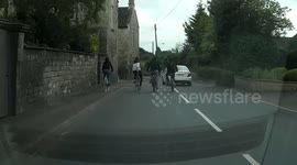 Youths cycling dangerously 4-abreast and doing wheelies on road