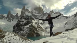 Playing with the snow in front of the Fitz Roy Mountain, Patagonia