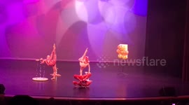 3 kids shoot bow and arrow with their feet